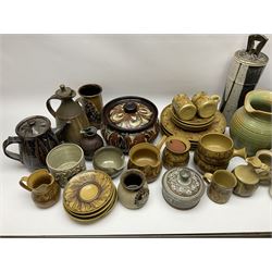 A group of assorted Studio Pottery, to include part dinnerware set comprising four dinner plates, four side plates, two jugs, preserve pot, gravy pan, and four soups bowls, together with a large green glazed jug, small butter jar, etc., of various form and decoration, various makers marks. 