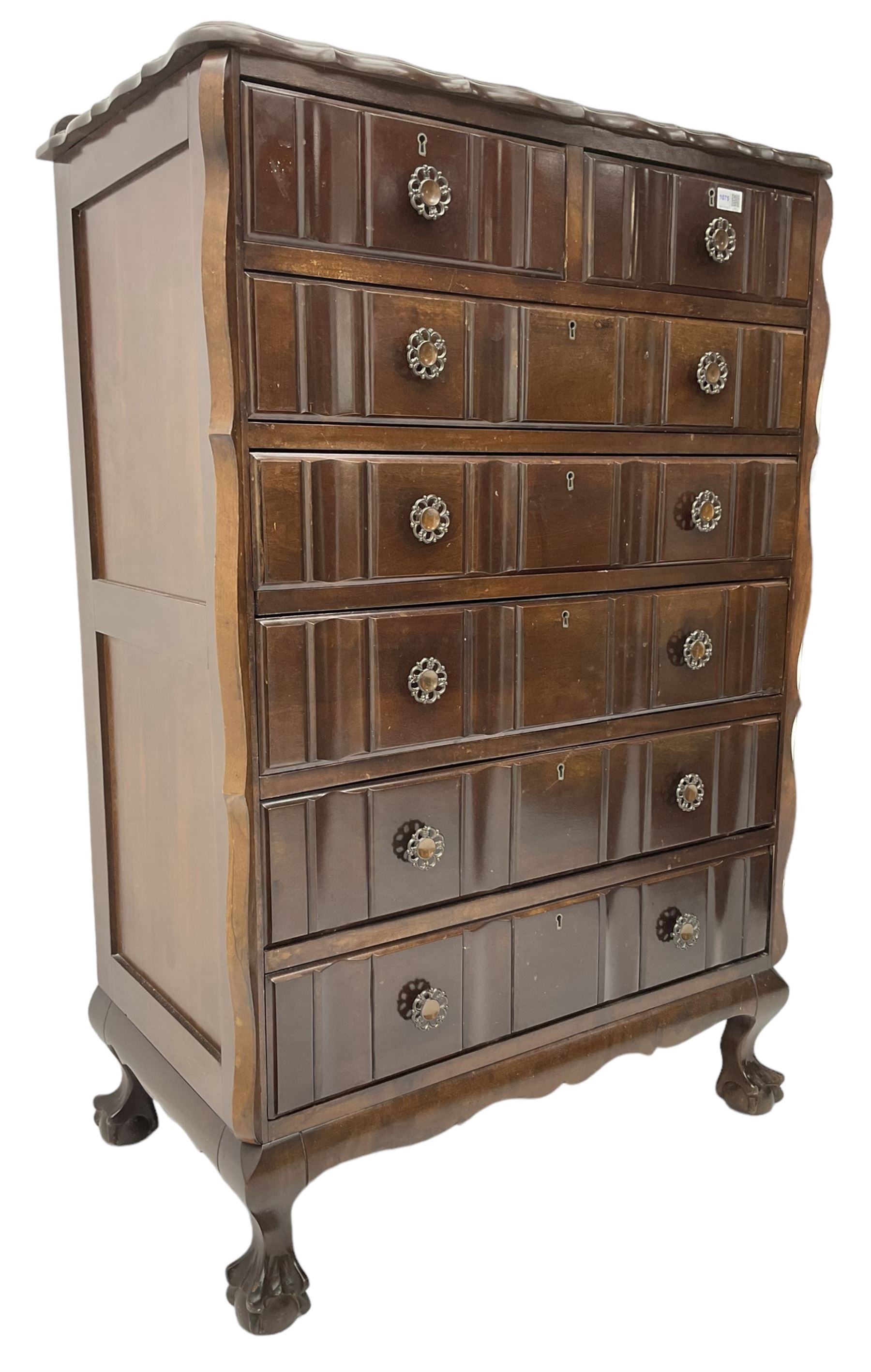 Early 20th century Dutch design mahogany chest, raised back over shaped top, fitted with two short and five long drawers, raised on ball and claw feet