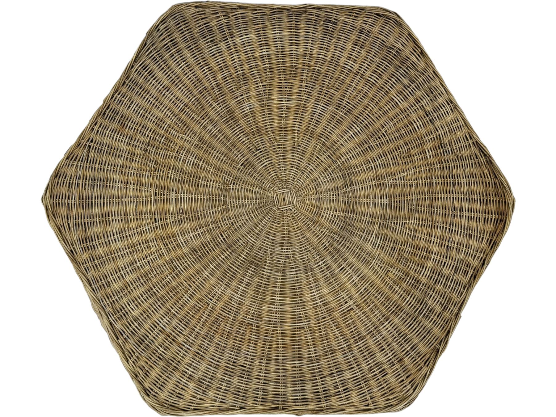 Mid-20th century hexagonal wicker coffee table, featuring woven top with pattern that radiates from the centre, lower shelf for additional storage, supported by interwoven wicker legs