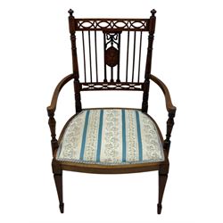 Edwardian inlaid rosewood elbow chair, pierced cresting rail over carved ribbon tie and oval inlaid panel, upholstered in stripe and floral pattern fabric, on square tapering supports with spade feet 