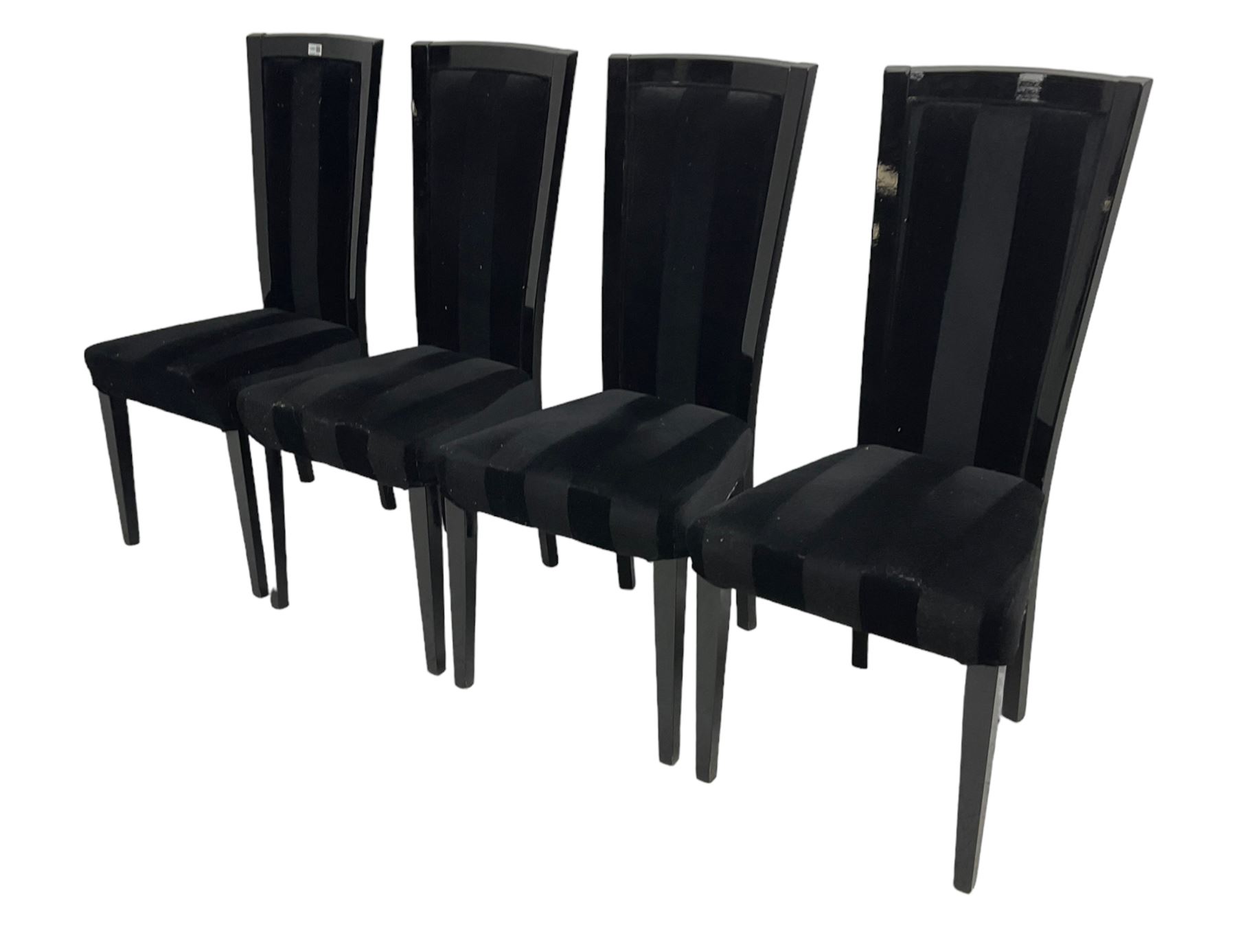 Set of four contemporary ebonised high back dining chairs, upholstered in black velvet fabric