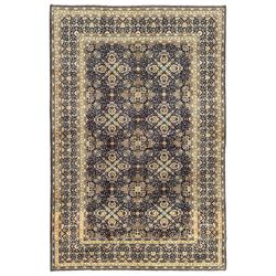 Persian indigo and pale gold ground rug, overall busy geometric design, the field decorate...