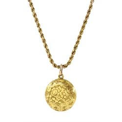 Early 20th century 18ct gold glazed locket pendant, engraved foliate decoration, on gold rope twist necklace, stamped 9ct