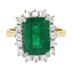 18ct gold emerald cut emerald and round brilliant cut diamond cluster ring, hallmarked, emerald approx 3.80 carat, total diamond weight approx 0.50 carat