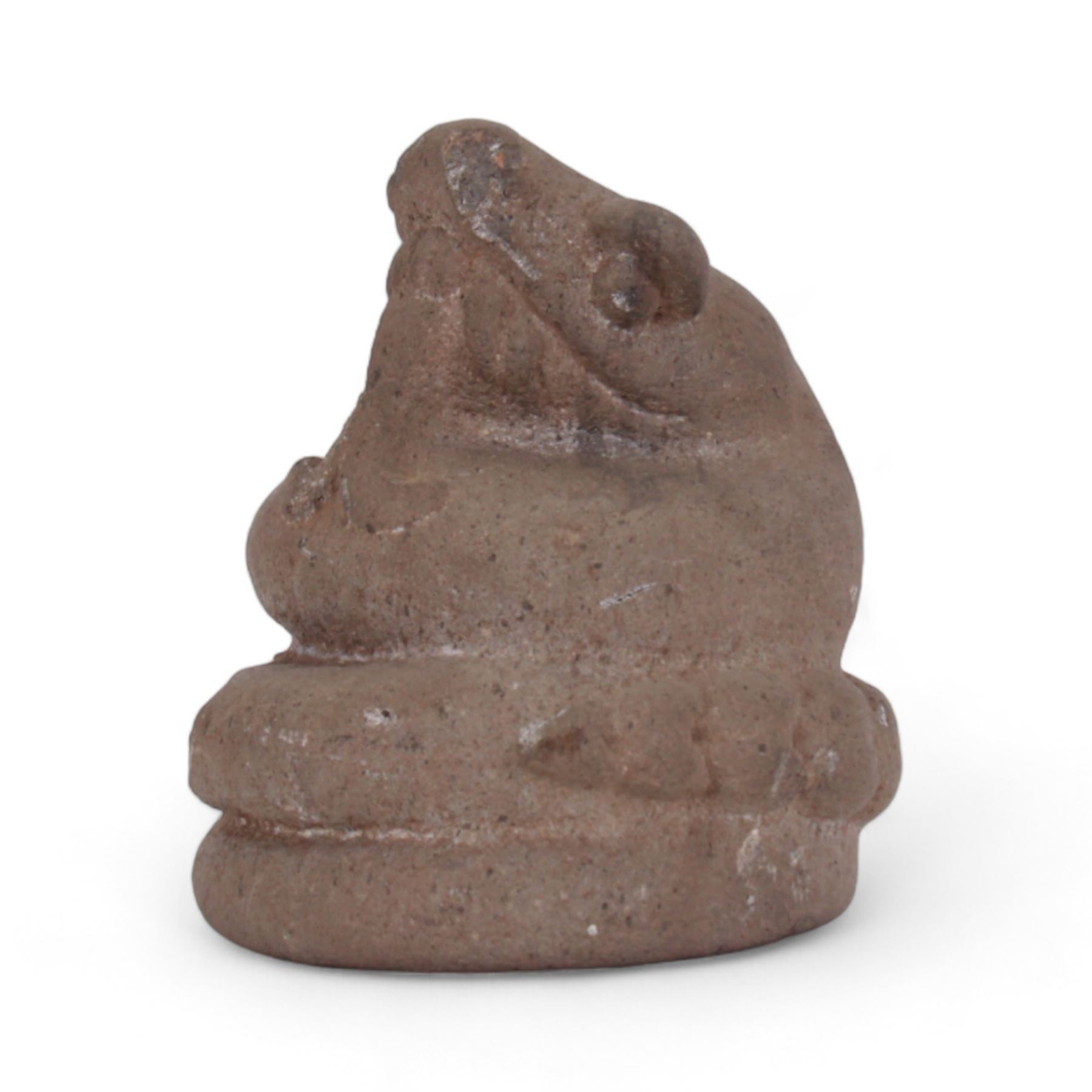 Pre-Columbian Aztec stone figure, carved as a coiled serpent with open mouth a protruding forked tongue, H17cm