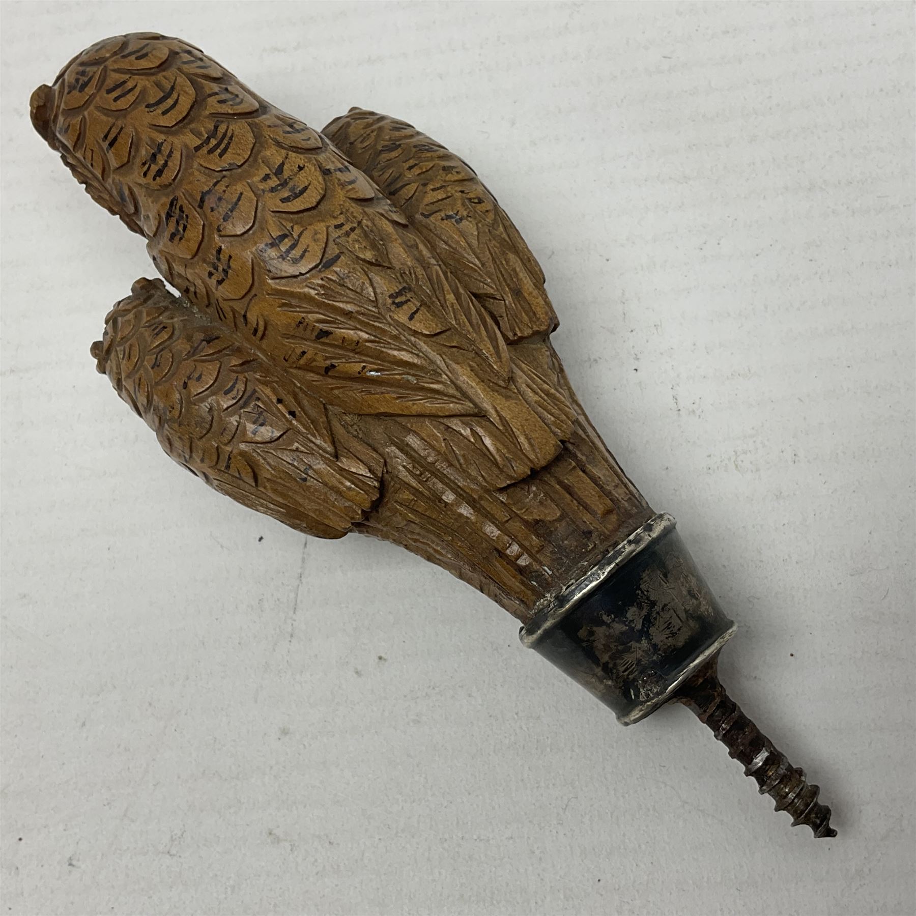 Late 19th/early 20th century Black Forest style carved walking stick handle, modelled as three owls with glass eyes, H9cm