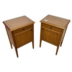 Pair of contemporary cherry wood bedside cupboards, inset glass top in moulded frame, fitted with single drawer over cupboard, on square tapering supports 