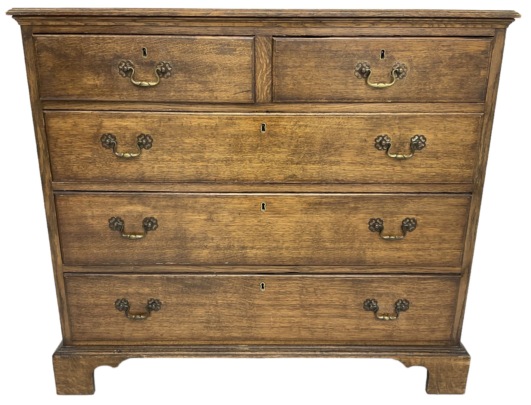 Early 20th century Georgian design oak chest, fitted with two short over three long drawers, lower moulded edge over bracket feet