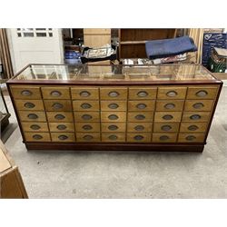 20th century mahogany and glazed haberdashery shop's display cabinet, fitted with thirty-five small drawers, on skirted base  - THIS LOT IS TO BE COLLECTED BY APPOINTMENT FROM THE OLD BUFFER DEPOT, MELBOURNE PLACE, SOWERBY, THIRSK, YO7 1QY