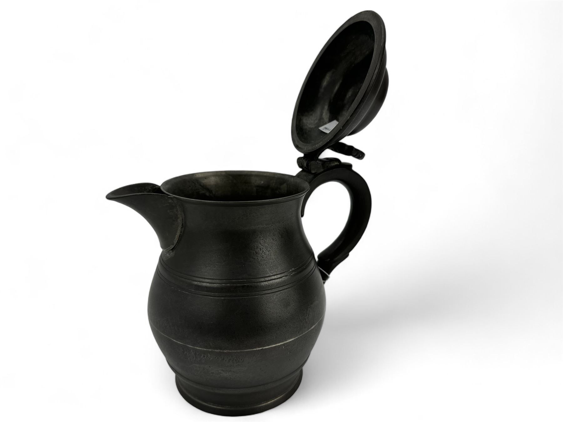 18th century pewter ale jug, circa 1790, with domed tappit lid and shell thumb piece, touch marks to base, H22cm