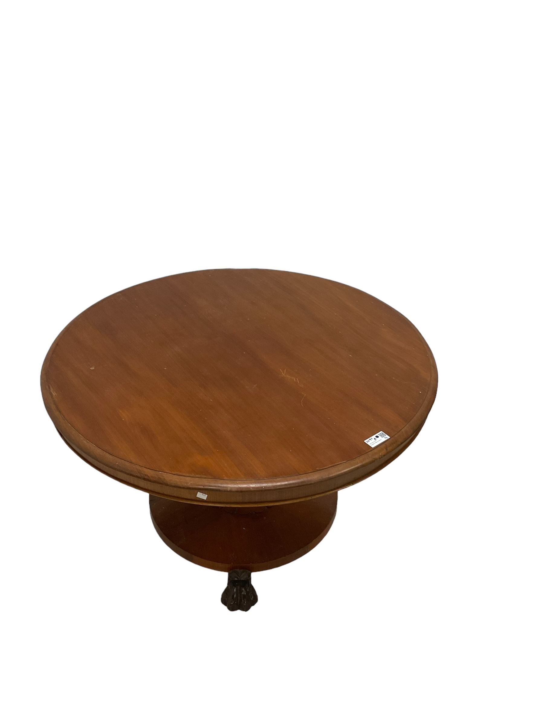 Victorian mahogany breakfast table, circular top with moulded edge, on a tapering pedestal with shaped collar on circular base, raised on three large paw feet