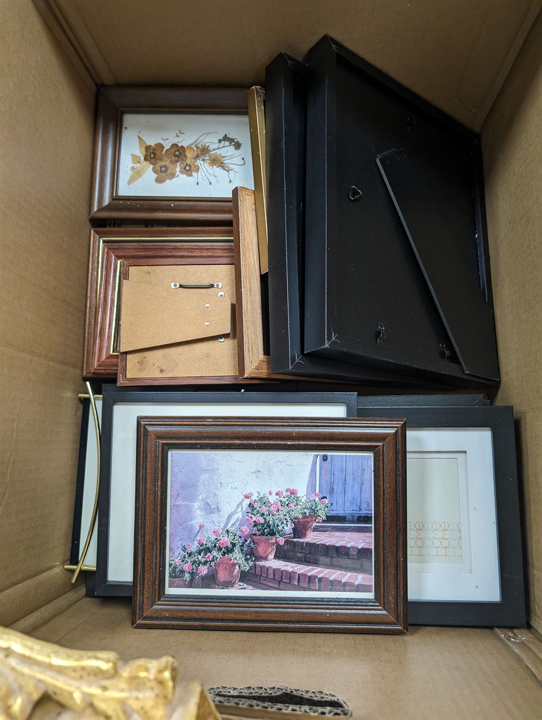 Three modern gilt wall mirrors and two boxes of photograph frames