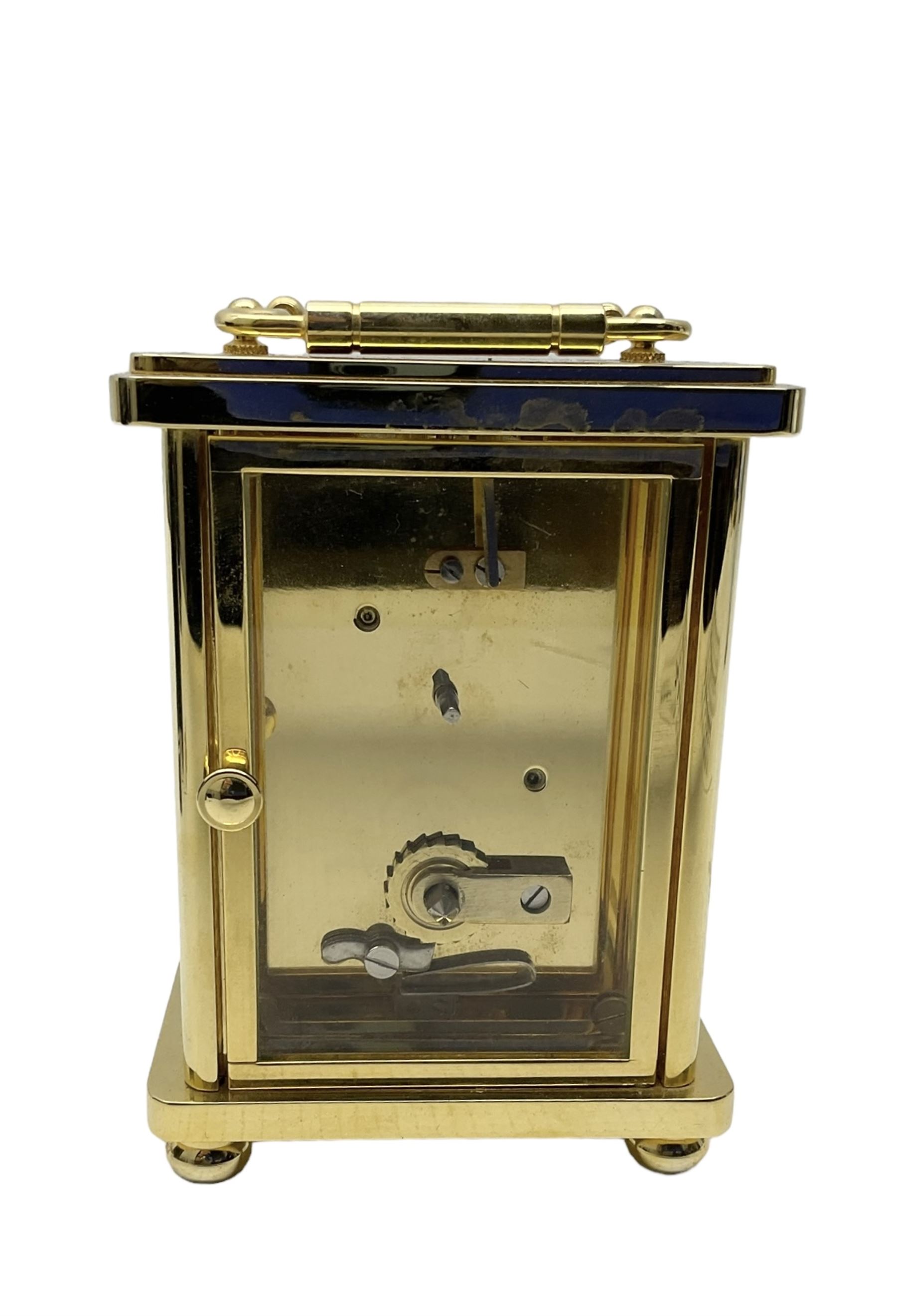 William Widdop - 20th century 8-day  brass cased carriage clock with an enamel dial, Roman numerals, minute track and steel moon hands, single train timepiece movement with a lever platform escapement, housed in a bespoke leather case, with key. 