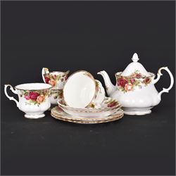 Royal Albert Country Roses tea for two set, comprising teapot, jug, sugar bowl, teacups, saucers and tea plates, all with printed mark beneath