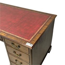 Georgian design mahogany twin pedestal desk, moulded rectangular top with red leather inset, fitted with seven drawers, on bracket feet 