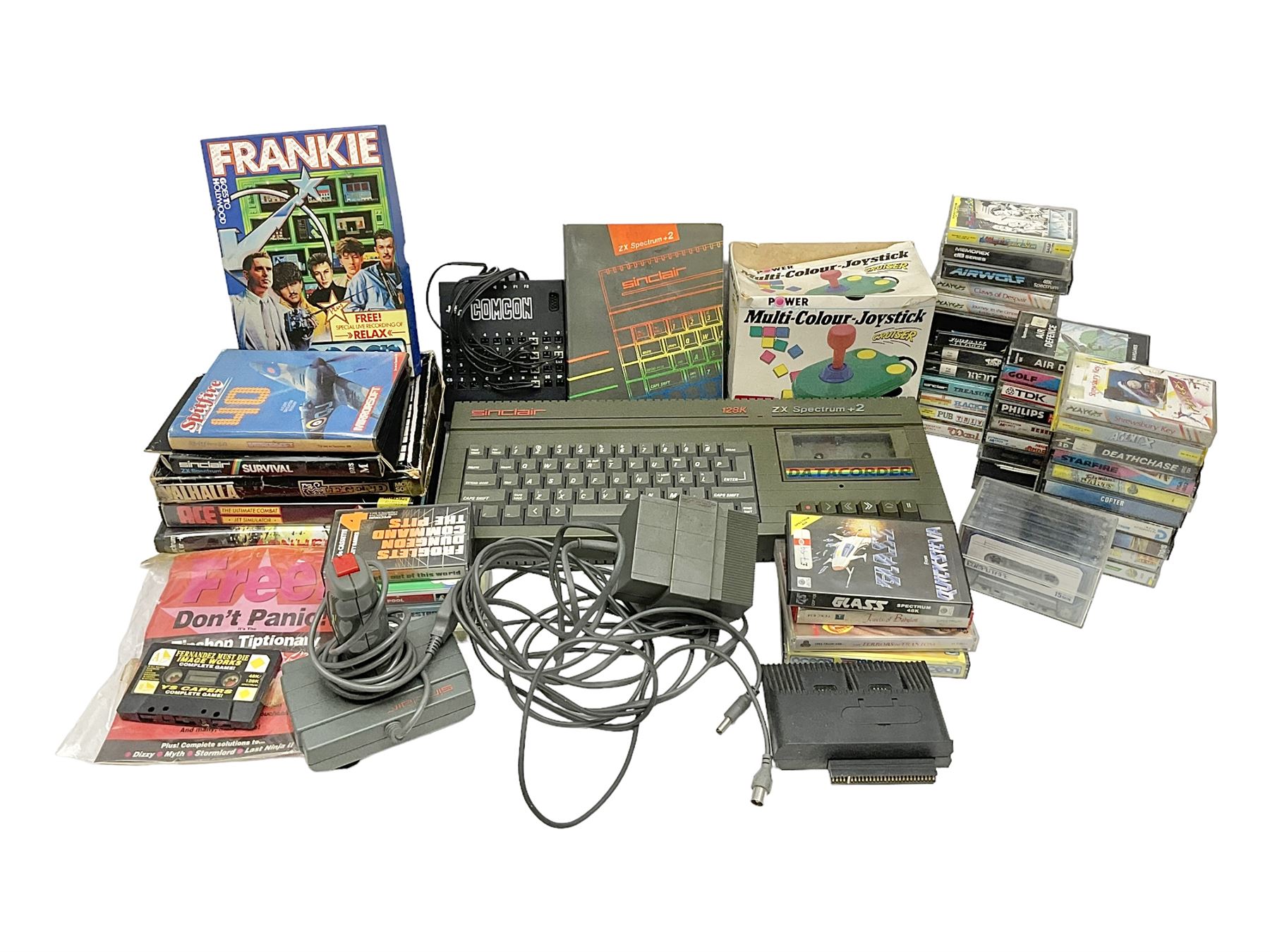 Sinclair ZX Spectrum +2 128k, Sinclair joystick, RAM Turbo joystick add-on, Comcon joystick interface, Power Supply Unit, unassociated multi-colour joystick, original instruction manual and a quantity of mostly Spectrum 48k games