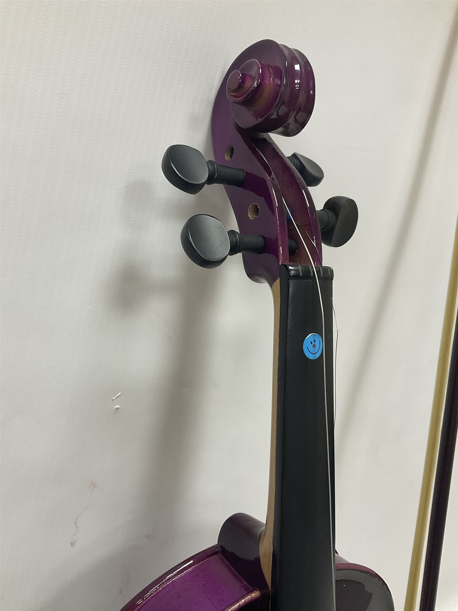 Intermusic 3/4 violin with a violet coloured solid wood body, ebonised fingerboard and fittings, bow and hard case, length 54cm