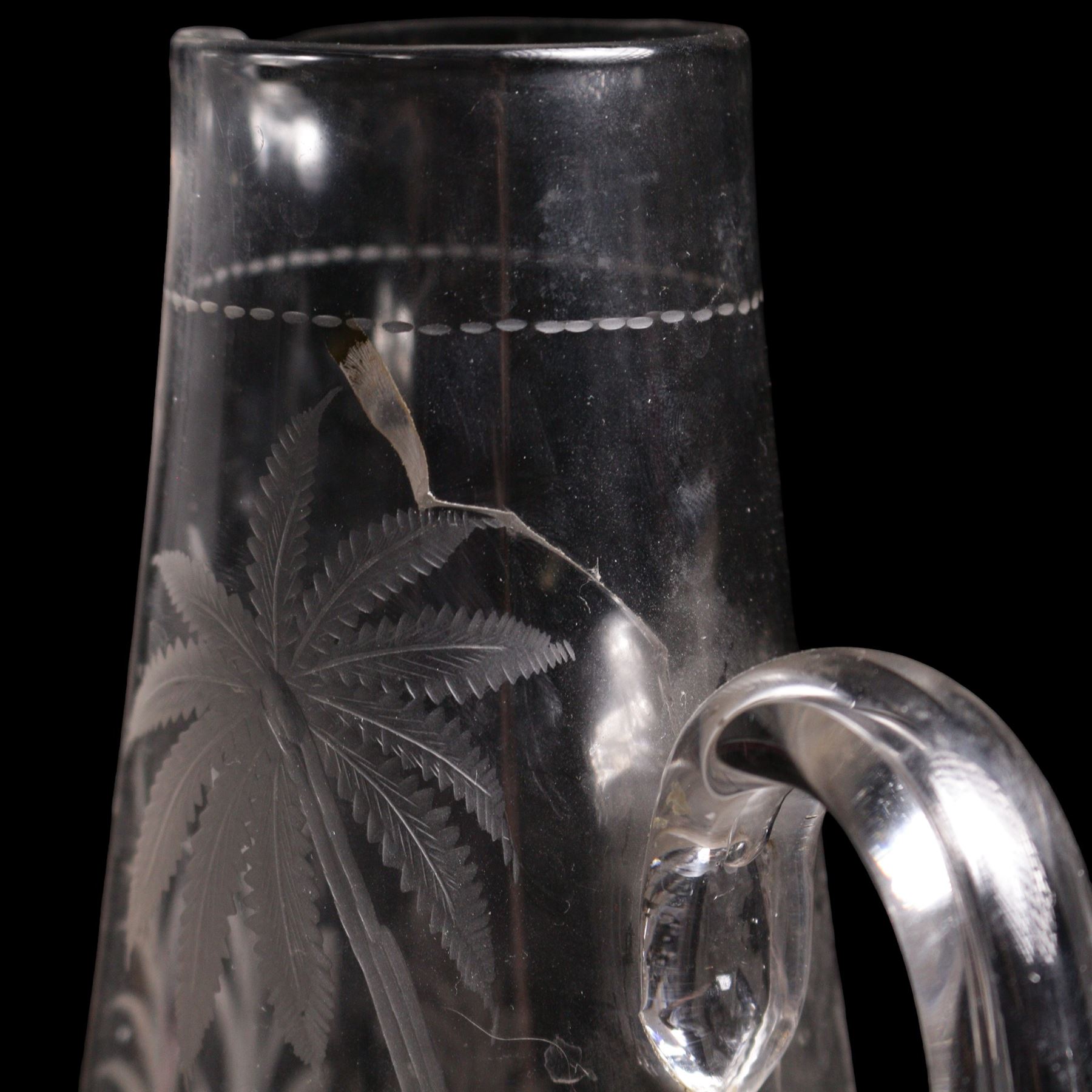 19th/ early 20th century crystal water jug, probably Stourbridge, of baluster form engraved with two Swans on a lake, amongst ferns, reeds and a palm tree, on circular pedestal star engraved foot, H28cm, heavy cut glass jar and cover on pedestal foot, together with a Lalique Samoa frosted glass scent bottle, signed Lalique, France, and labelled 11312 H8cm (3)