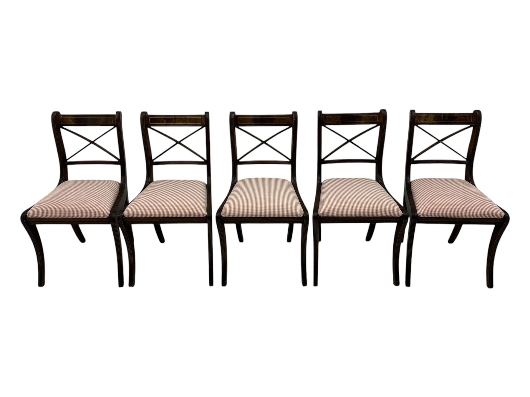 Set of ten (8+2) Regency design mahogany and brass inlaid dining chairs, bar cresting rail over x-framed back, upholstered drop-in seats, moulded frame and sabre supports 