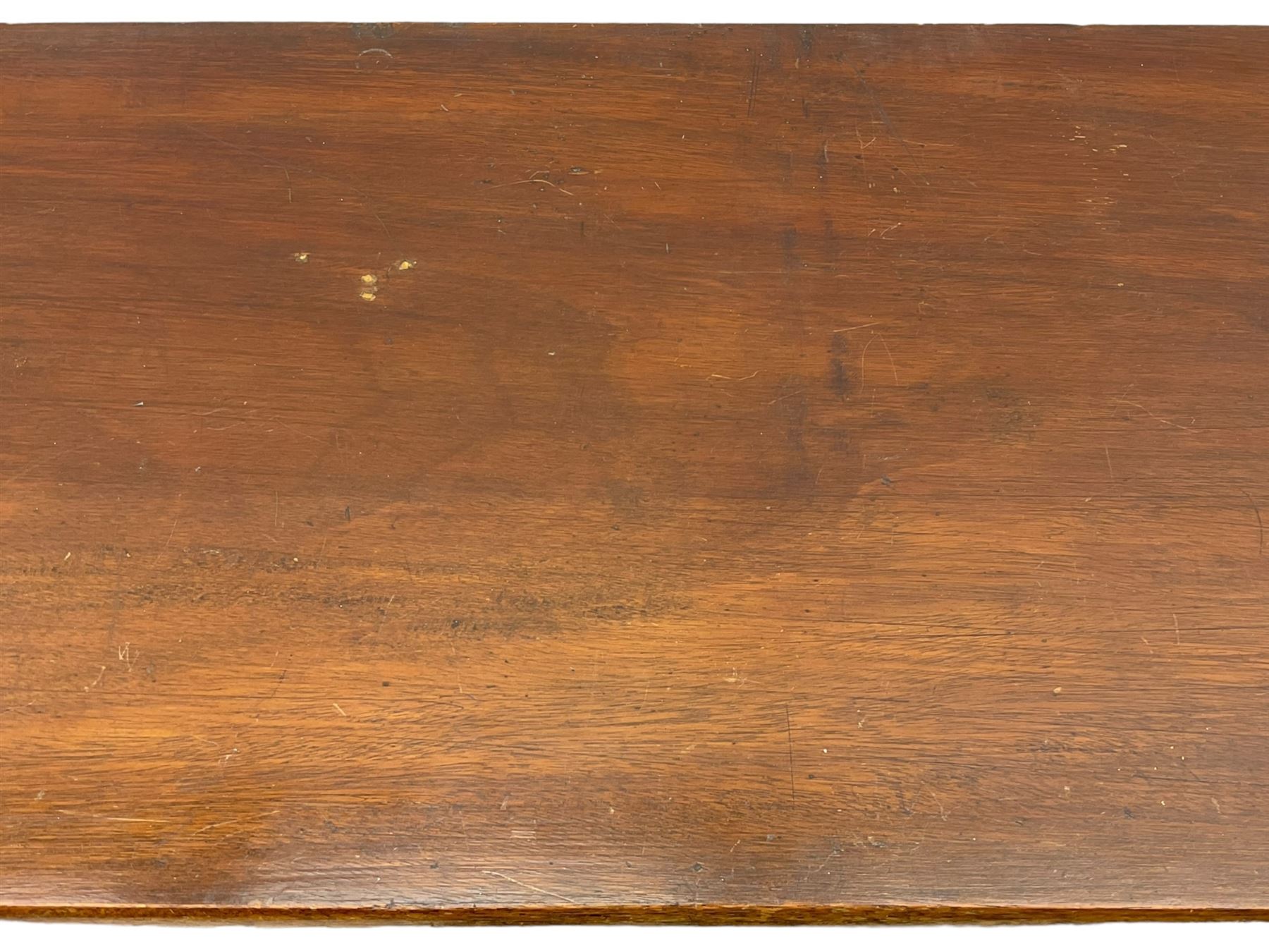 Early 20th century mahogany bookcase, rectangular top over two glazed doors, fitted with four adjustable shelves, on turned bun feet 