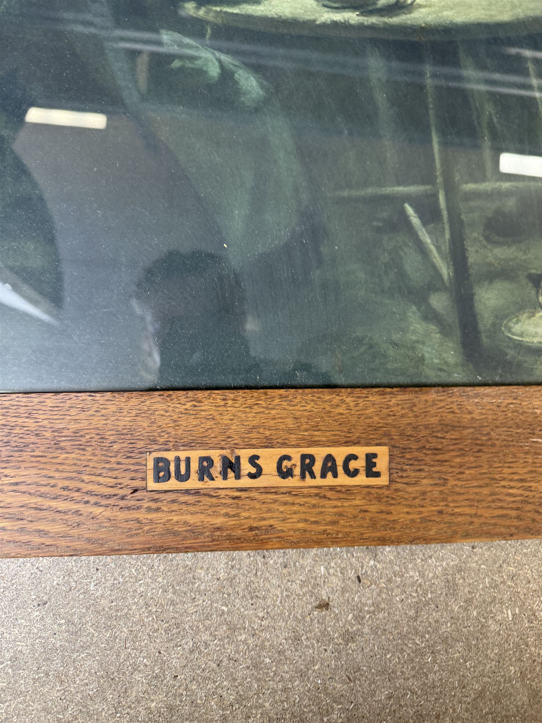 Arts and Crafts Motto frame, circa 1900, inlaid with an oval plaque depicting a cottage, two inlaid motto panels with title inlaid below 