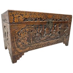 Chinese carved camphor wood blanked chest, rectangular hinged top, carved all over with traditional dragon motifs and junk ships