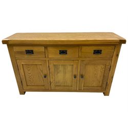 Contemporary light oak sideboard, fitted with three drawers over three panelled cupboards enclosing shelving, on square supports