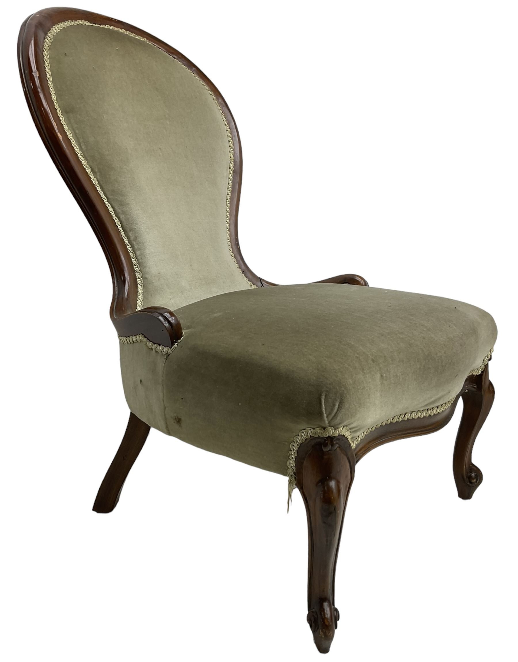 Victorian design nursing chair, moulded spoon back upholstered in green fabric, on scroll carved cabriole feet