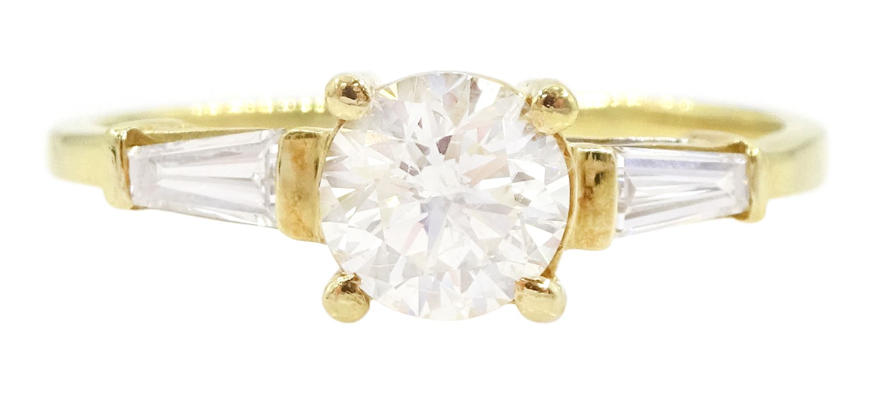 18ct gold single stone round brilliant cut diamond ring, with tapered baguette diamond shoulders, stamped 750, principal diamond approx 0.65 carat, total diamond weight approx 0.85 carat