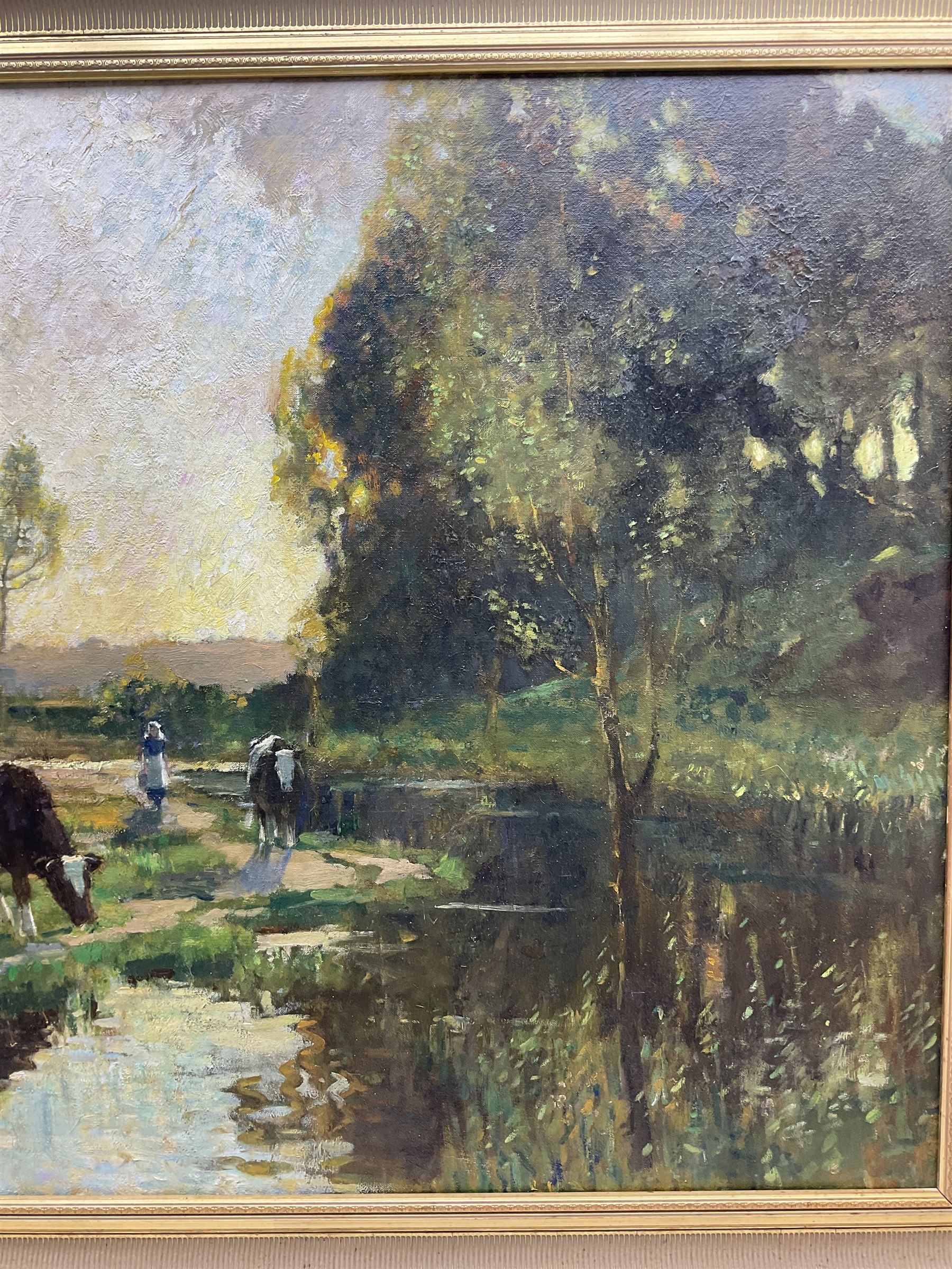 Bertram Priestman RA ROI NEAC (British 1868-1951): Cattle and Country Girls by the Riverside, oil on canvas signed and dated '19, 82cm x 135cm