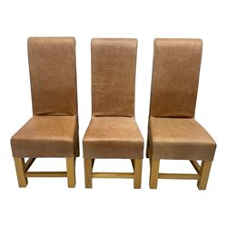 Set of six contemporary light oak dining chairs, each with high back and seat upholstered in pale tan leather, on square supports connected by H-stretcher