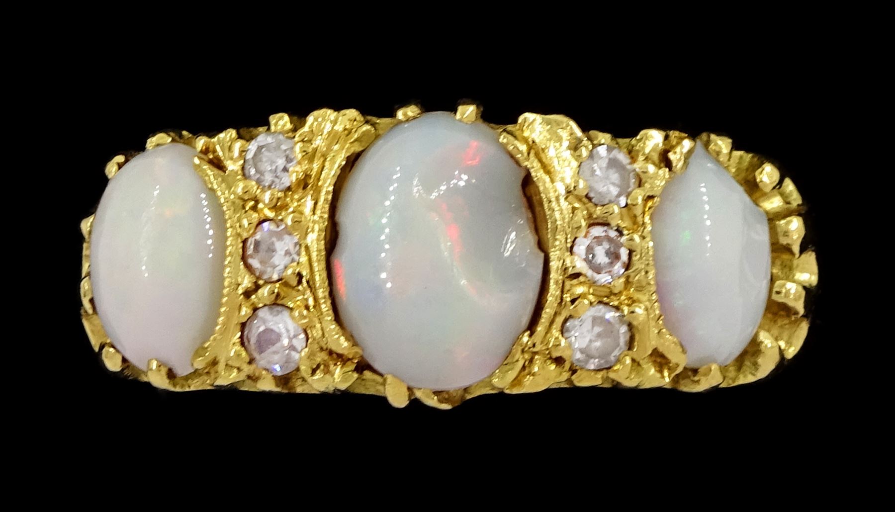 18ct gold three stone opal and six stone diamond ring, London 1966