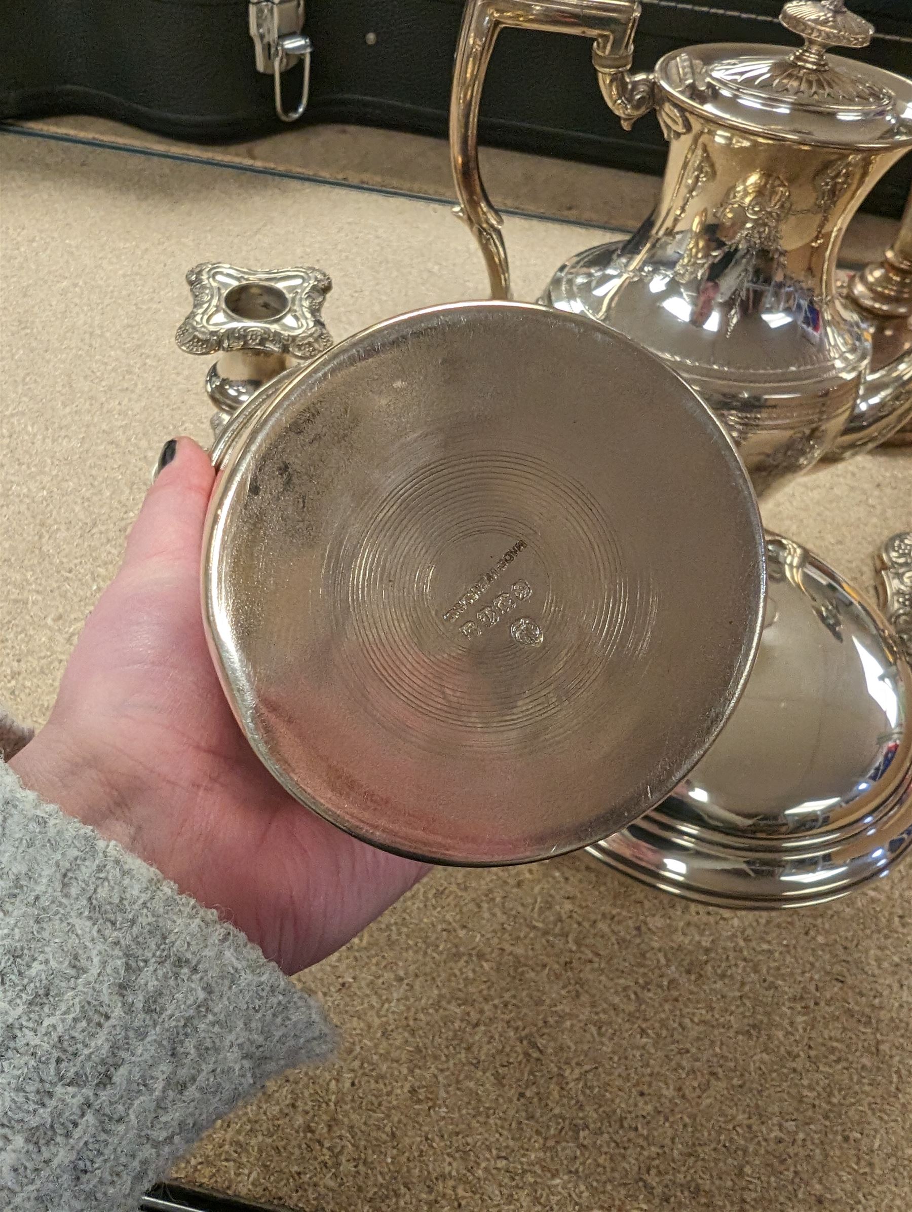 Silver plated items, including cocktail shaker, candelabra, pair of candlesticks, coffee pot and serving dish