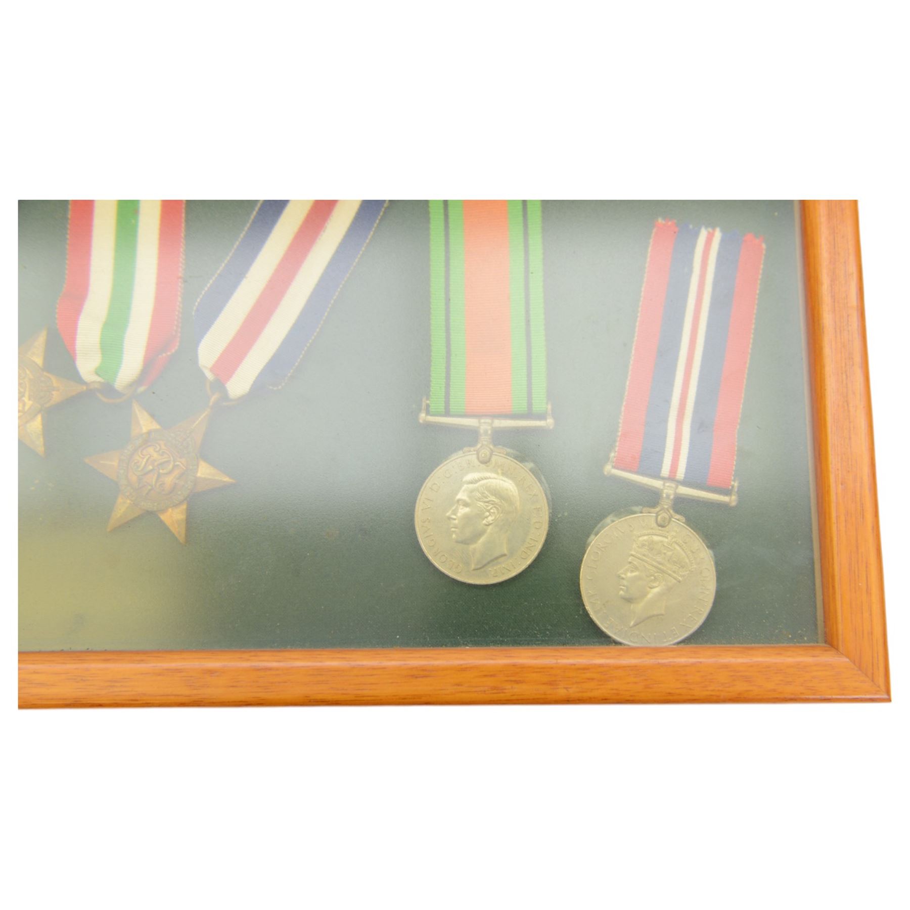 World War II medal group, comprising 1939-45 Star, Pacific Star, Burma Star, Italy Star, 
Atlantic Star, 1939-45 War medal and General Service medal, in glazed frame 