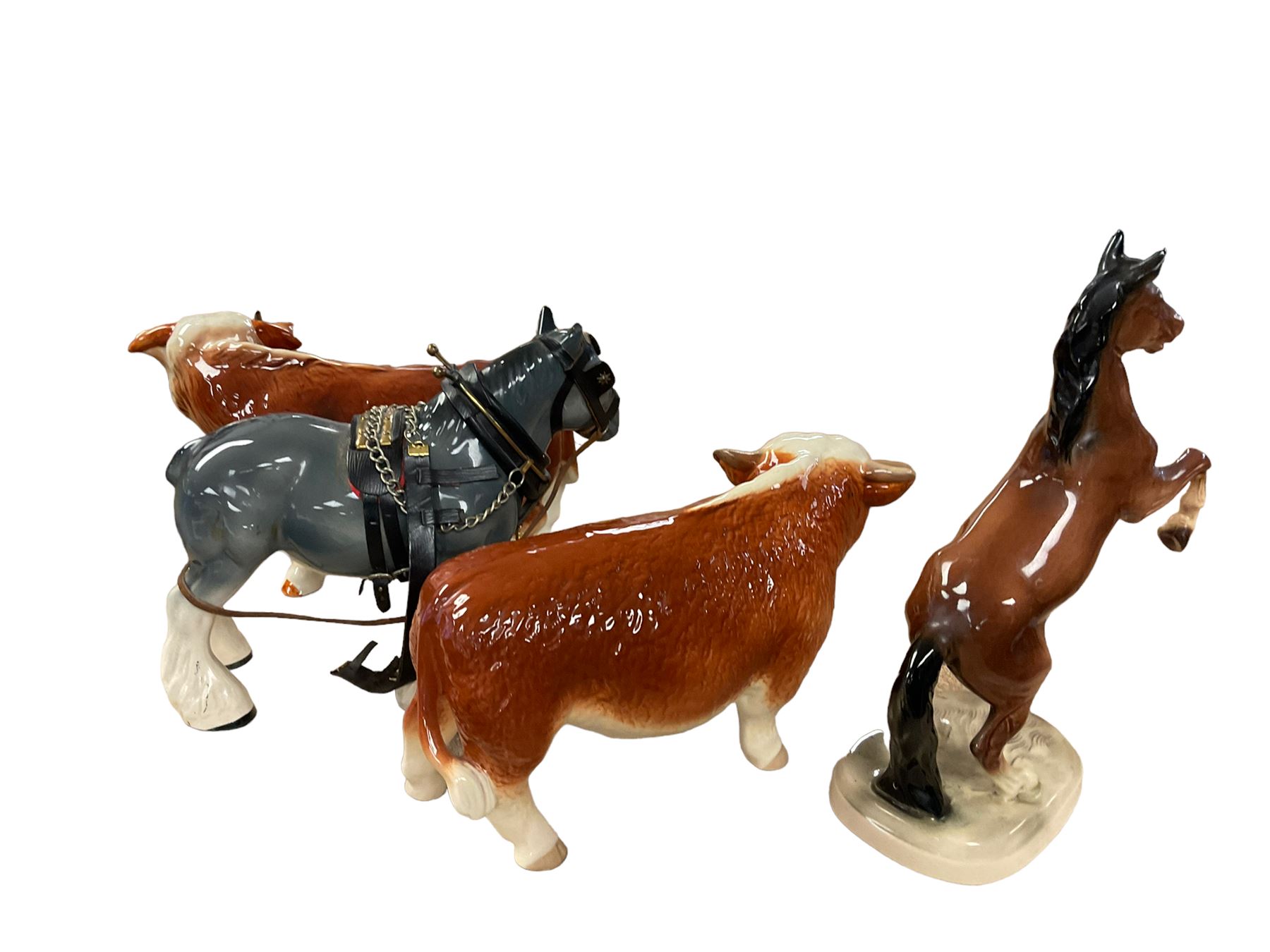 Two ceramic bulls, and two ceramic horses, tallest H27cm