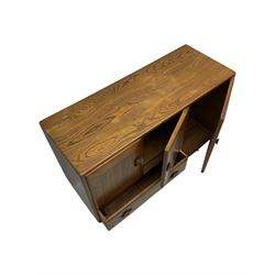 Lucian Ercolani for Ercol - 1960s elm sideboard, fitted with double cupboard, single cupboard and drawer, on tapering supports 