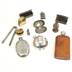 Pewter hip flask in the form of a cricket ball, two other hip flasks, Ashanti bronze figure, two 19th century horn snuff boxes, vintage lighter, pair of steel nutcrackers etc 