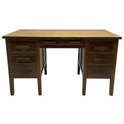 Early 20th century oak desk, rectangular top over six drawers and two slides, on square supports 