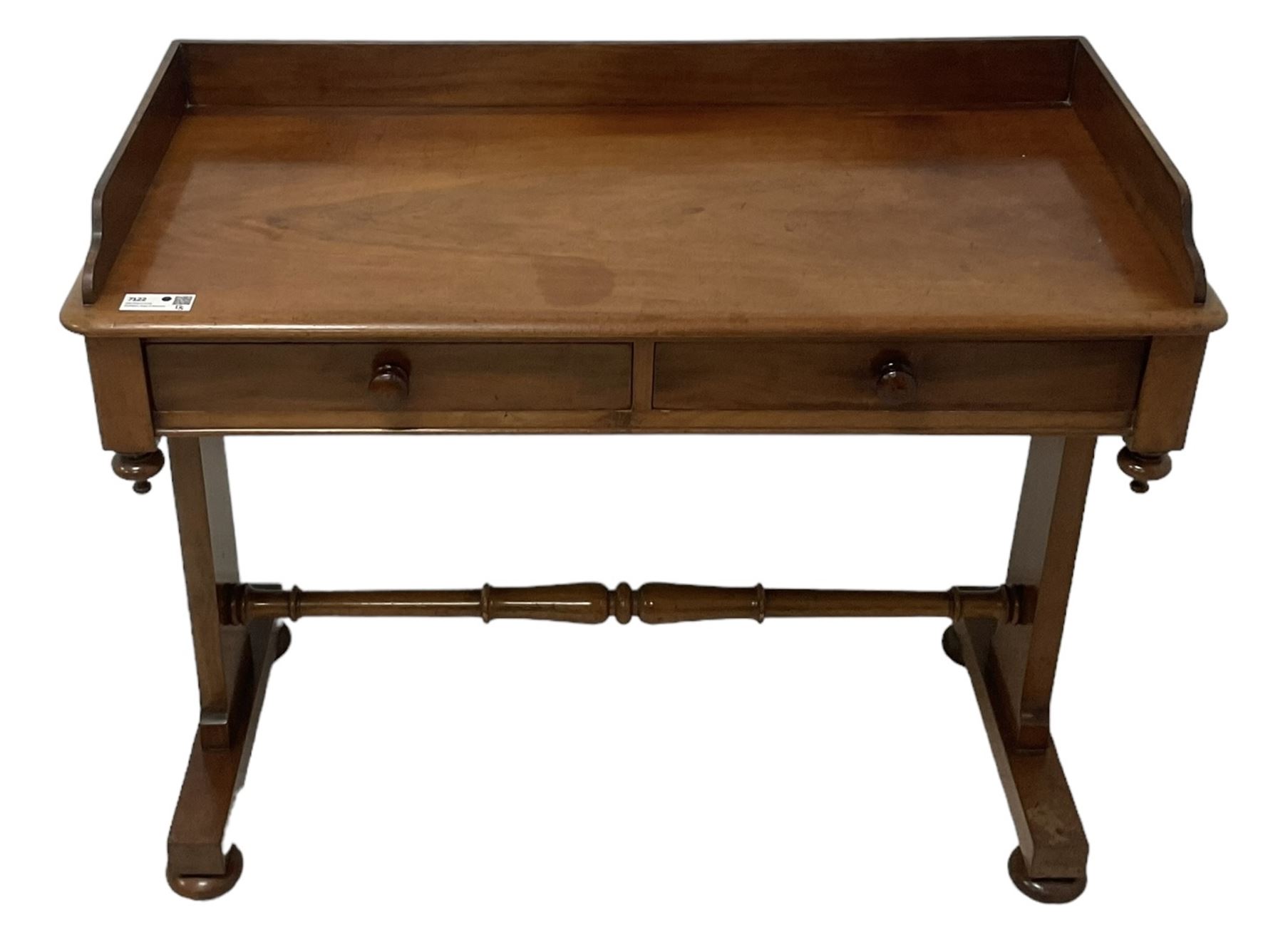 Victorian mahogany washstand, three-quarter raised gallery back, rectangular top with over two drawers, on shaped end supports united by ring-turned stretcher