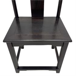 Pair of early 19th century Chinese Qing dynasty black wood side chairs, yoke cresting rail over shaped back panel, panelled rectangular seat on square supports united by stretchers 