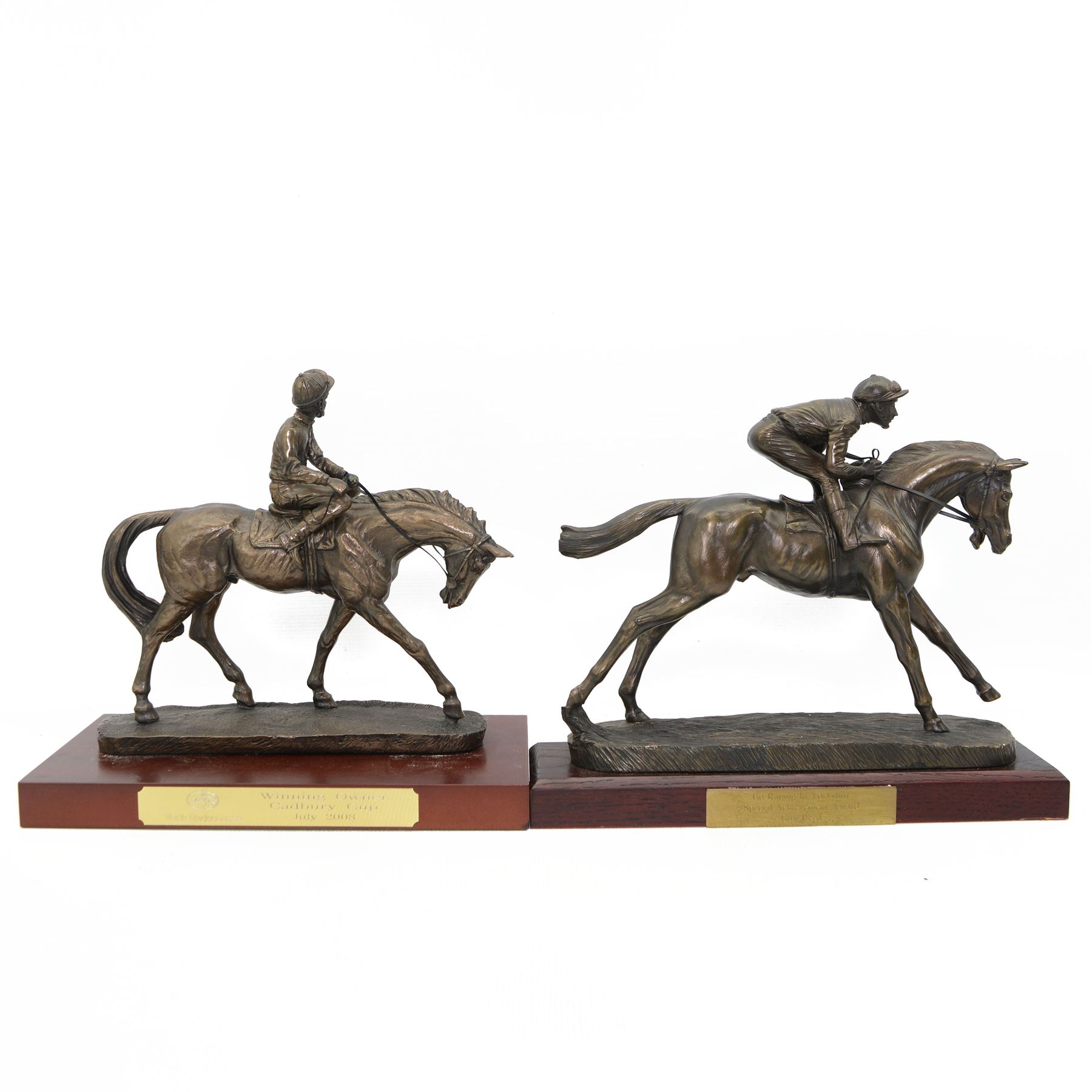 'Go Racing in Yorkshire Special Achievement Award, Guy Reed' - Bronze resin figure of a racehorse with jockey up on wooden plinth 30cm x 35cm and another 'Winning Owner Cadbury Cup July 2008 York Racecourse' on wooden base 30cm x 33cm (2)