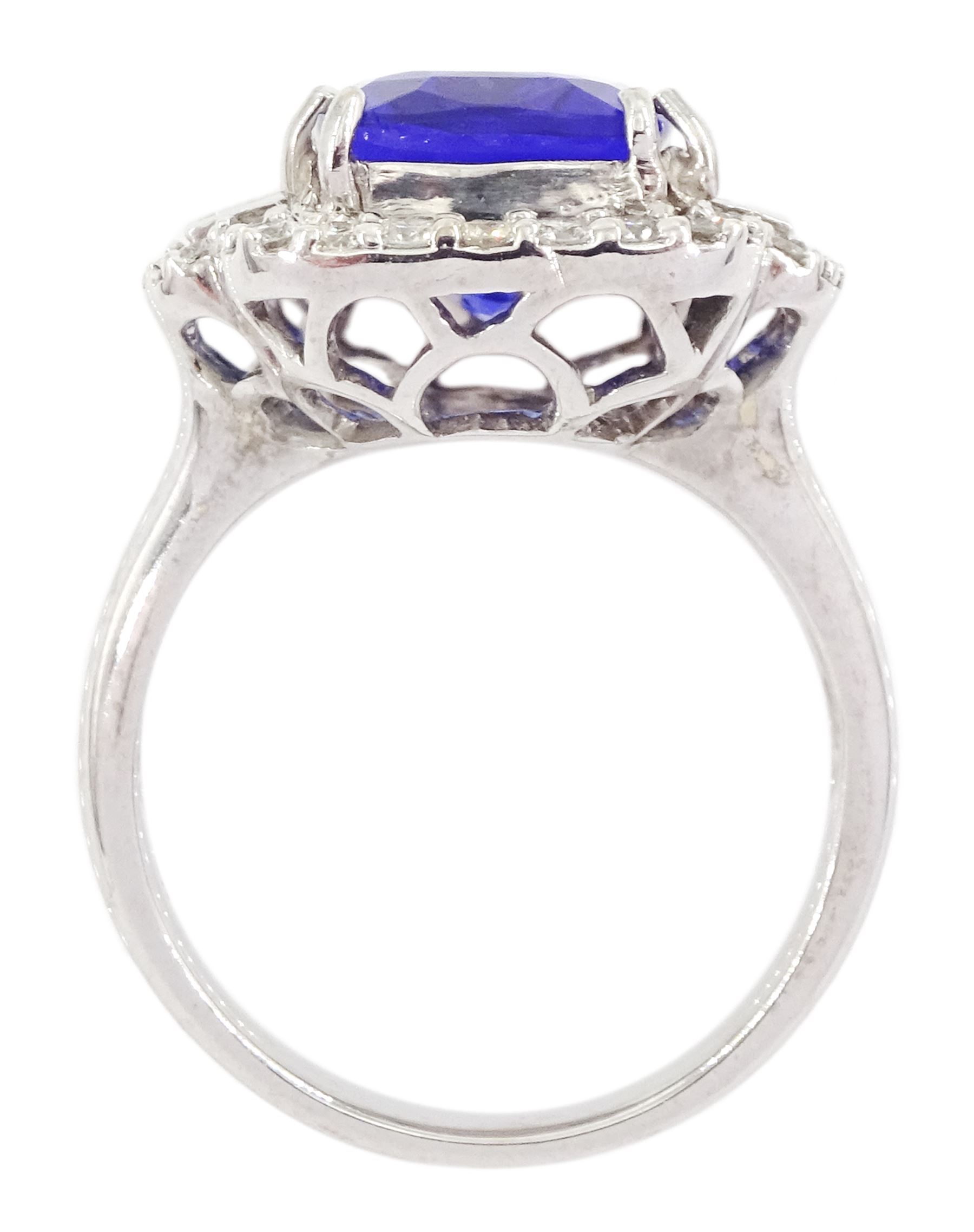 18ct white gold tanzanite, baguette and round brilliant cut diamond cluster ring, stamped 750, tanzanite approx 6.15 carat, total diamond weight approx 0.65 carat