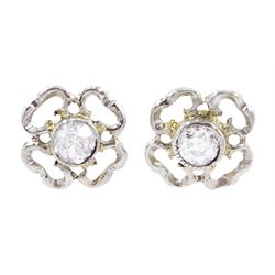 Pair of gold and platinum old cut diamond flower head stud earrings