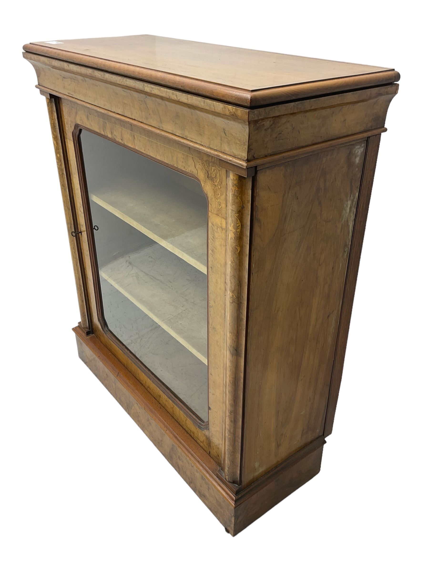 Victorian inlaid walnut pier display cabinet, moulded rectangular top over cavetto frieze, the moulded upright inlaid with scrolling foliage, fabric lined interior fitted with two shelves enclosed by single glazed door, on moulded plinth base 