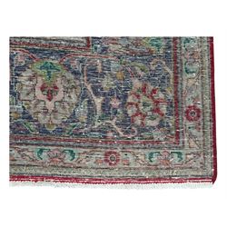 Persian rose ground rug, large central floral medallion surrounded by scrolling foliate and floral motifs, pale green spandrels, wide border in pale green and navy with intricate floral designs, framed by multiple guard stripes with repeating floral and geometric patterns