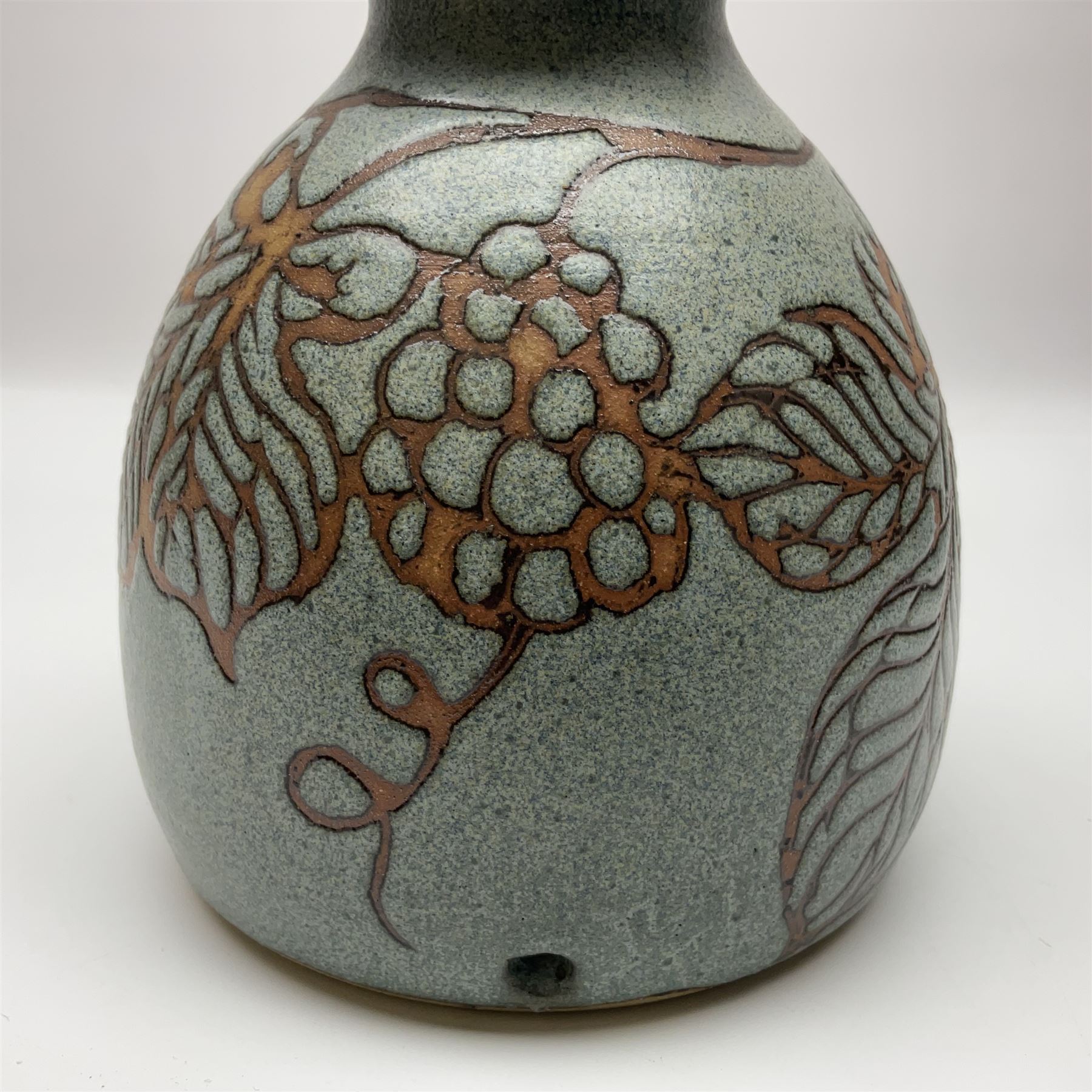 John Egerton (c1945-): studio pottery stoneware, comprising wine cooler decorated with herons on a mottled ground, covered storage jar with foliage decoration and a lamp base decorated with grape vines, wine cooler H23cm