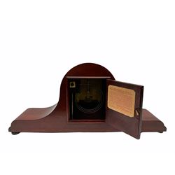 Mid-20th century Mahogany finished Tambour mantle clock with an eight-day striking movement, striking the hours and half-hours on a coiled gong, with a 5-1/2”white dial, Roman numerals and minute track, winding collets, spun bezel with convex glass.
With pendulum
