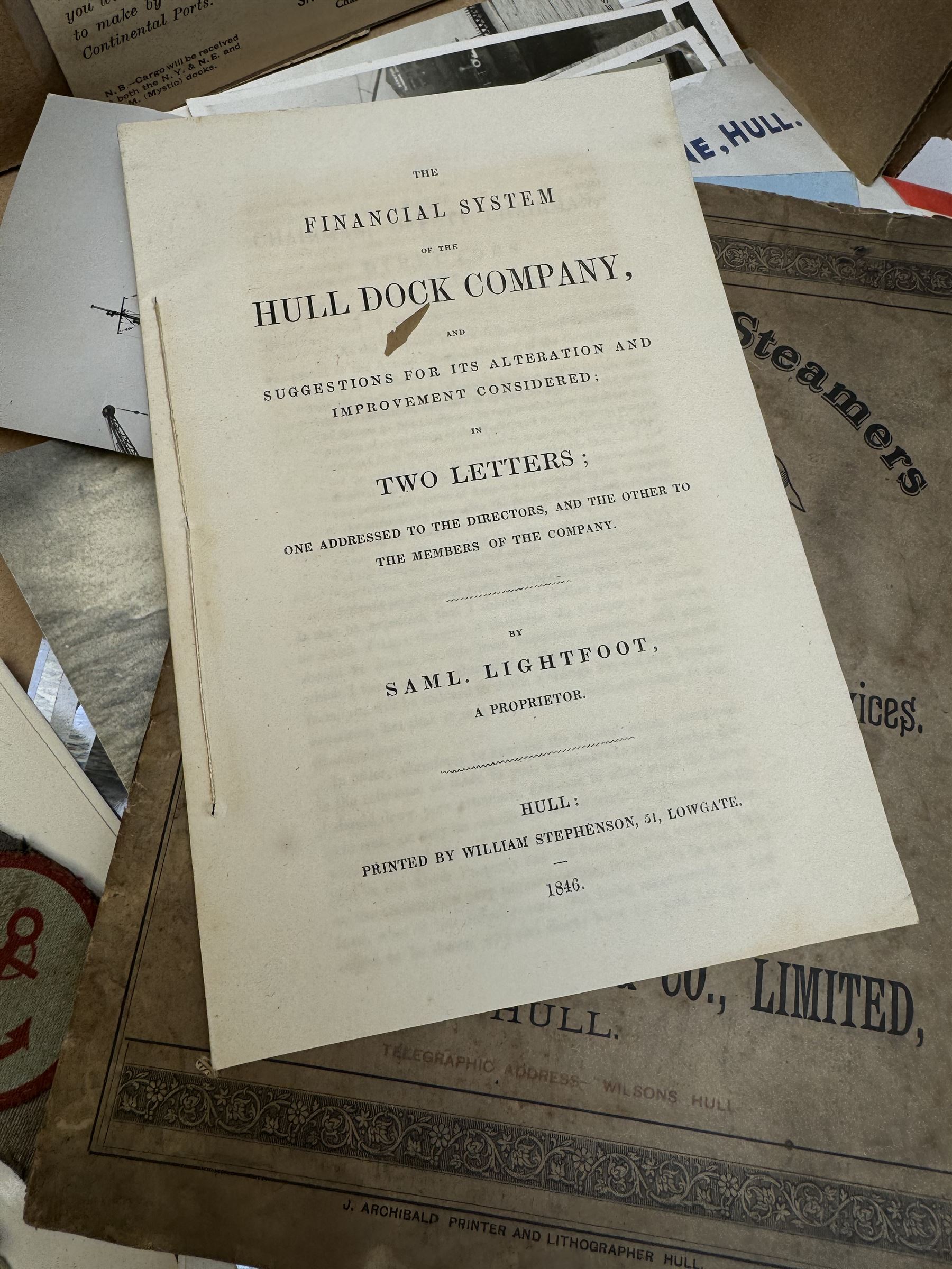 Collection of martime and shipping collectables, including brass cased gimbal compass, marked Castle & Co, Hull, cast iron Britains Pride doorstop, buttons, Lloyds Register, photographs, postcards and other ephemera