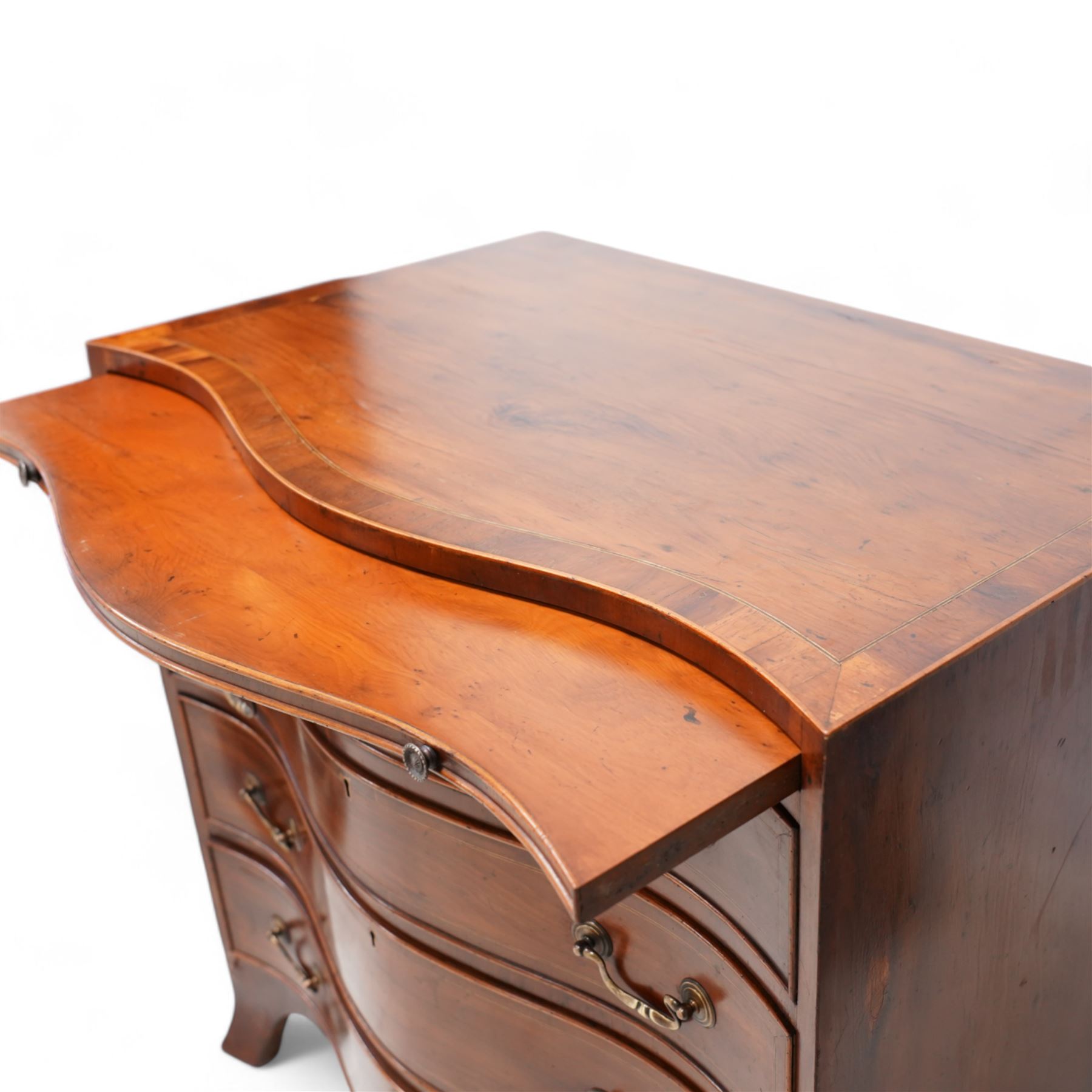 Georgian design yew wood serpentine chest, crossbanded top over brushing slide and four graduating cock-beaded drawers, brass swan neck handles and circular plates, shaped apron with splayed bracket feet 