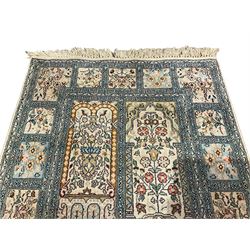 Fine Persian Kashmir ivory and pale indigo ground runner rug, the field decorated with sixteen rectangular panels depicting Mirab motifs and other traditional carpet designs, the border with repeating square panels of floral bouquets and foliate patterns